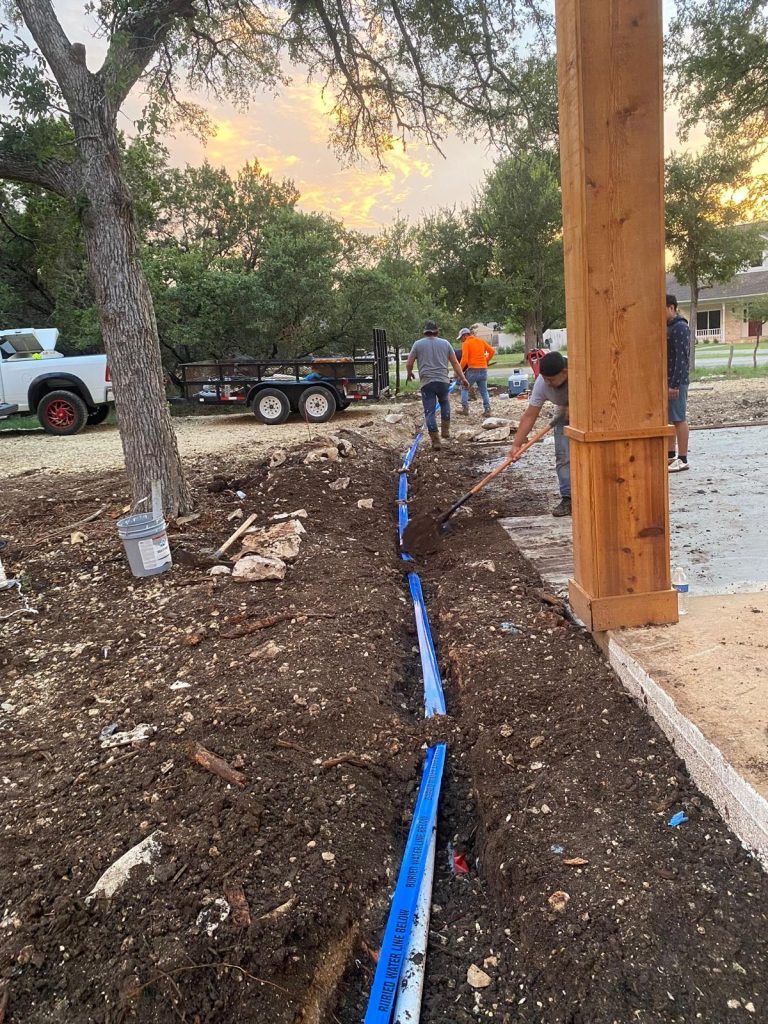 Four construction workers at a construction site.