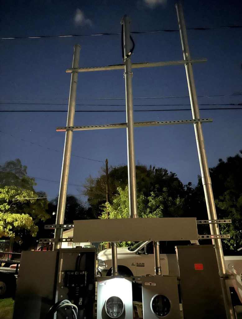 Electrical installation with three masts, meters and weatherheads