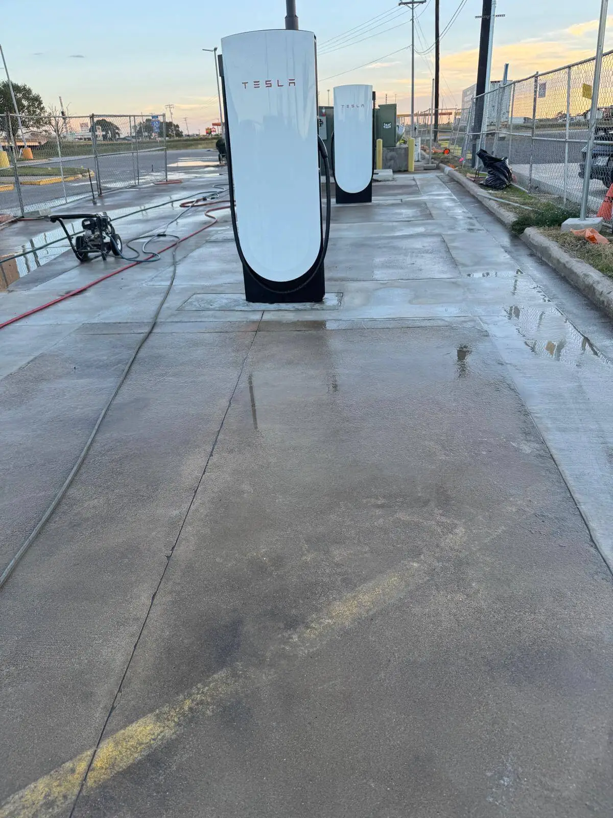 Clean view of a completed Tesla Supercharger station project after site restoration and concrete work by Soga Underground.