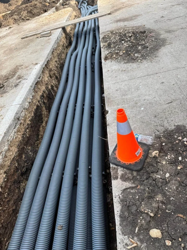 Multi-duct flexible conduit installation for electrical and telecommunications in an open trench by Soga Underground.