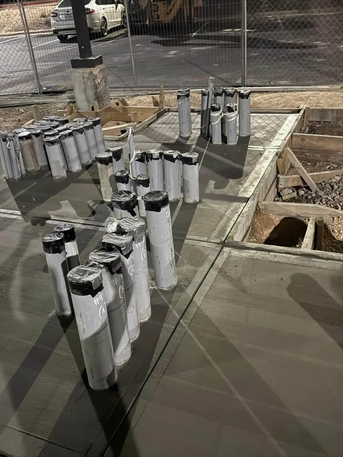 organized underground utility conduit layout before concrete slab pour in commercial construction